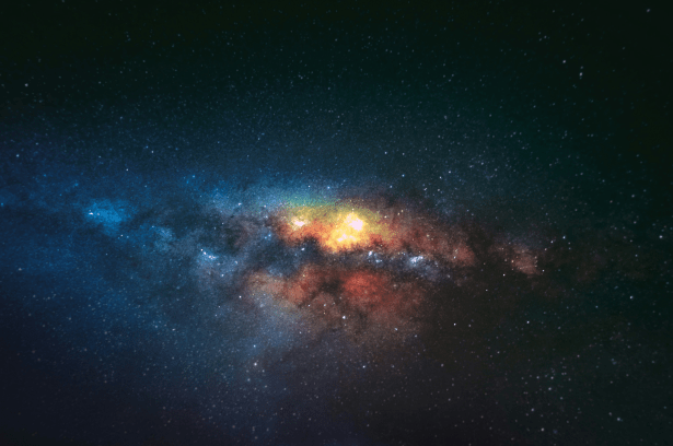 The Milky Way galaxy shining in vastness of space, displaying spiral arms and countless stars